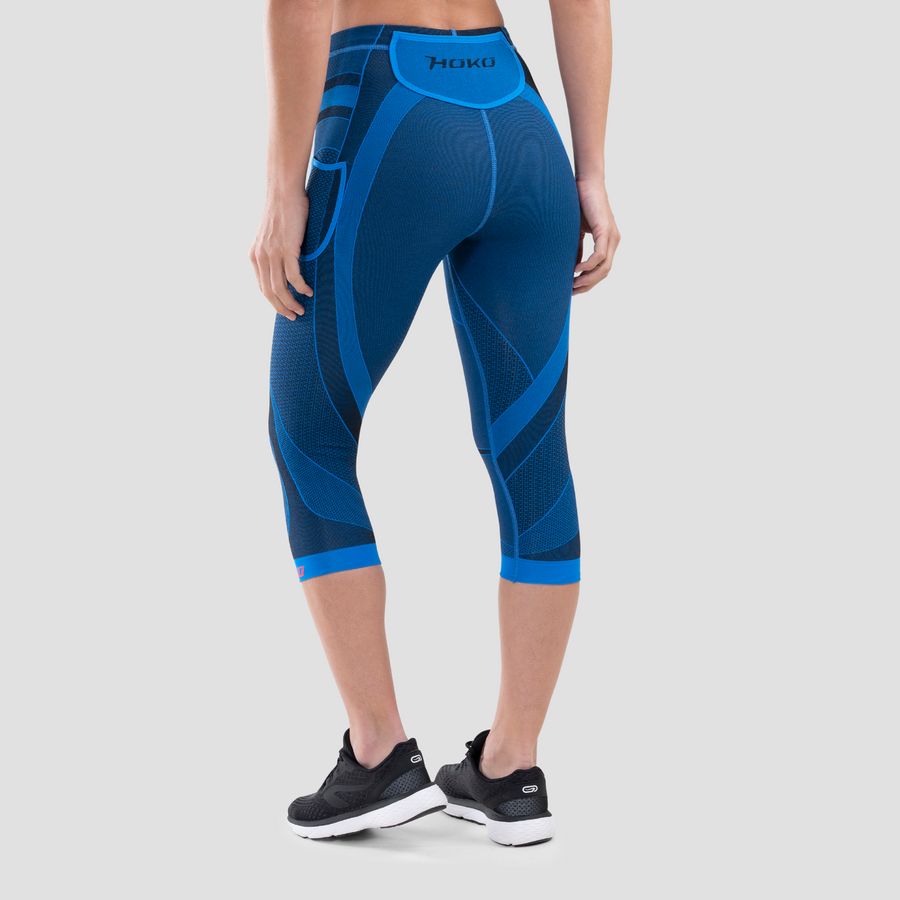 Malla pirata compresiva de trail para mujer. Nombre del producto Rika. Color azul. Foto trasera